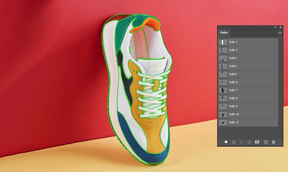 path experts are doing multiple clipping path on a standing shoe